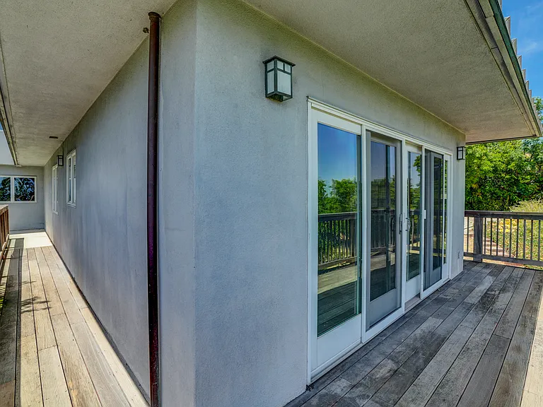 Cozy deck and the wrap around hanging walkway.