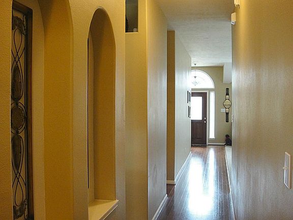 View of extended foyer with beautiful hardwood flooring.