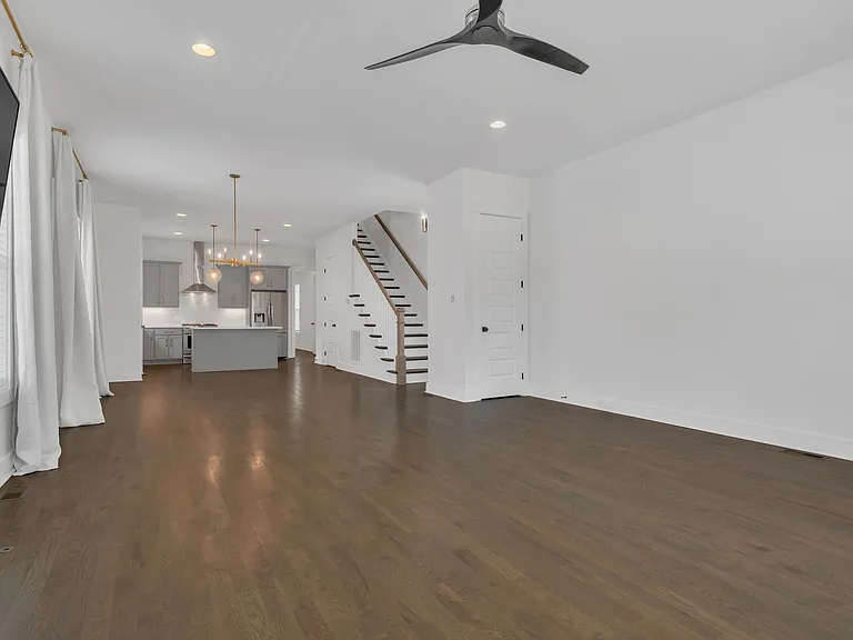 First floor, inside front door. Coat closet on right in front of stairs.