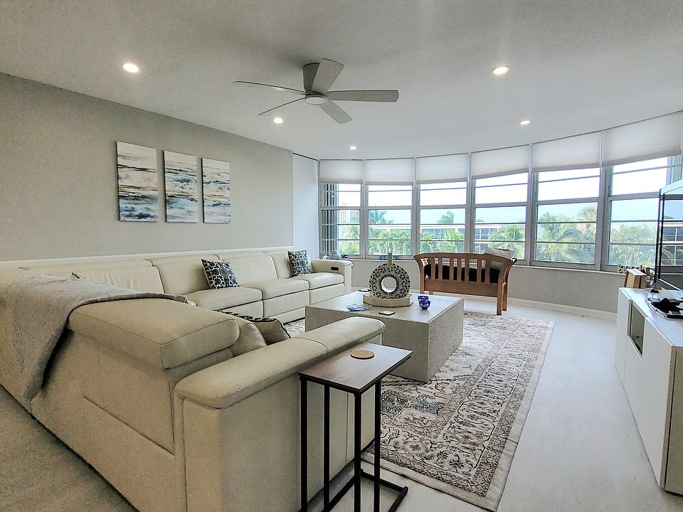 Open concept living room with stunning view of the marina.