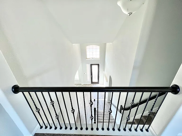 2-story foyer view from the game room