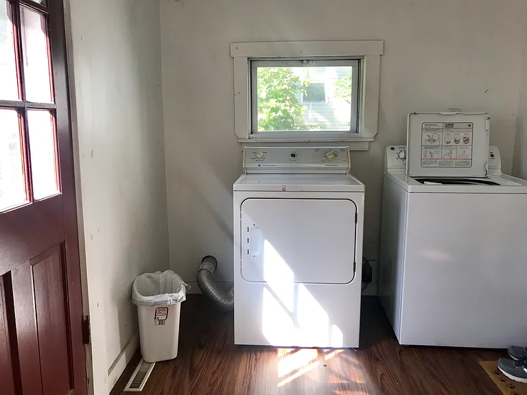 Shared laundry located in mudroom off rear.