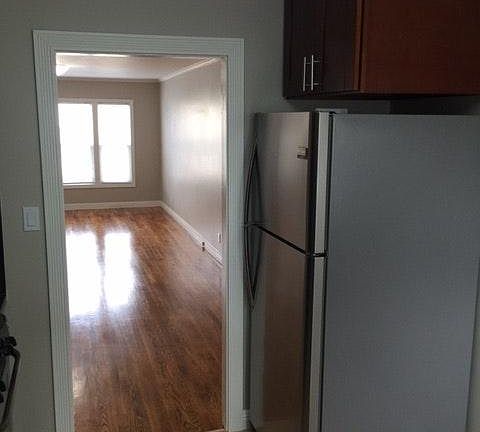 Kitchen looking into living room