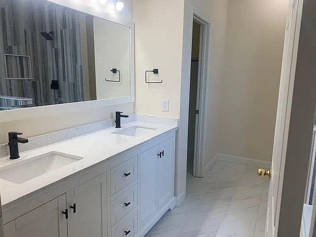 Another view of designer vanity and dual sinks.