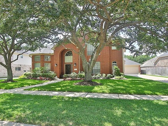 The extra long driveway will accommodate guest parking. Many homeowners install a wrought iron gate across the drive to provide an extended play area for children.