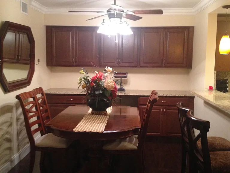 view of dining room which also has a office built in on back wall with electric and lighting