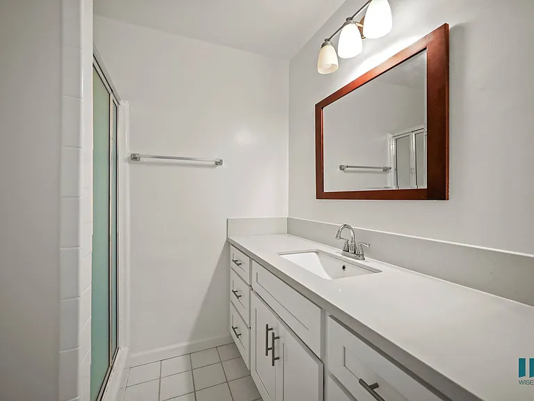 Bathroom with a Walk-In Shower and Vanity Cabinet Storage and Drawers
