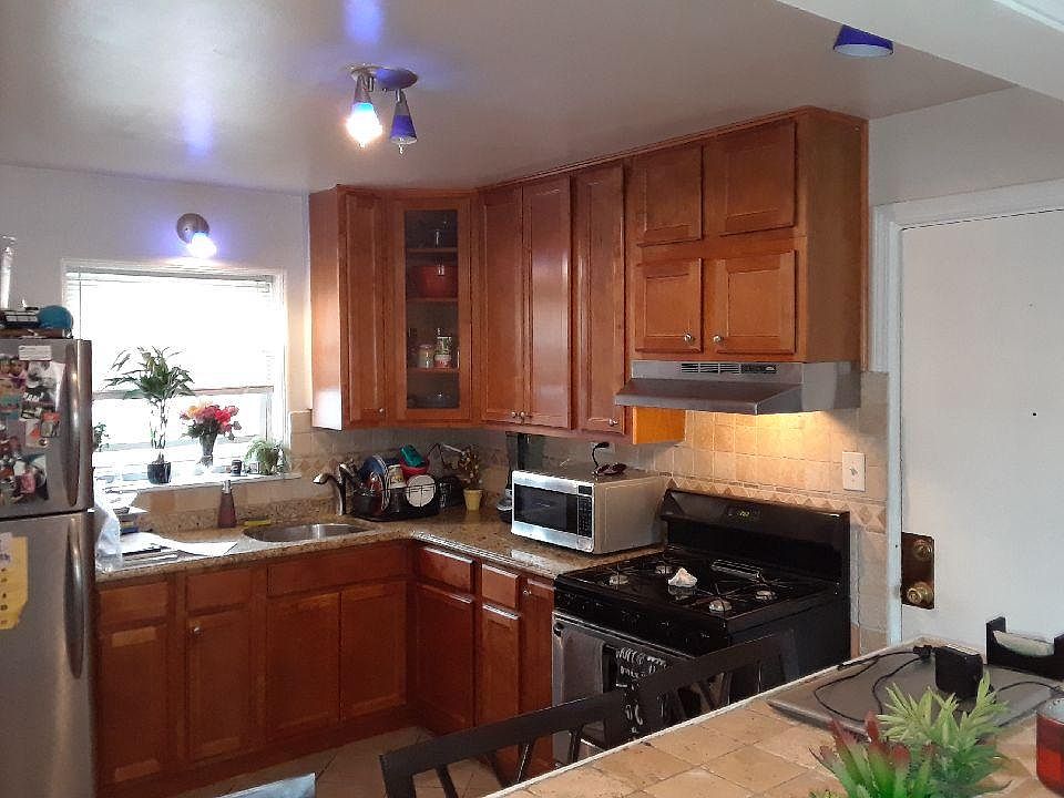 Beautiful Open layout kitchen with 42" tall cabinets and granite countertops plus stainless steel appliances
