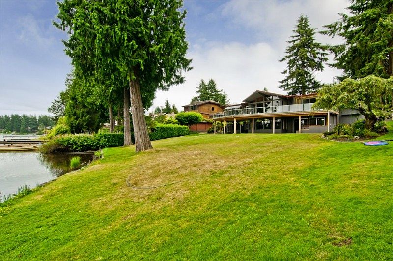 Welcome home, sprawling yard , huge house on your private piece of lake front