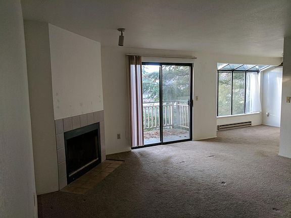 Living room with wood burning fireplace
