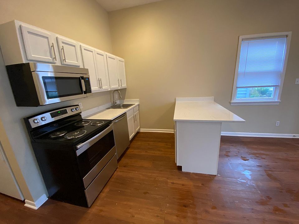 Kitchen with new stainless steel appliances and quartz countertops