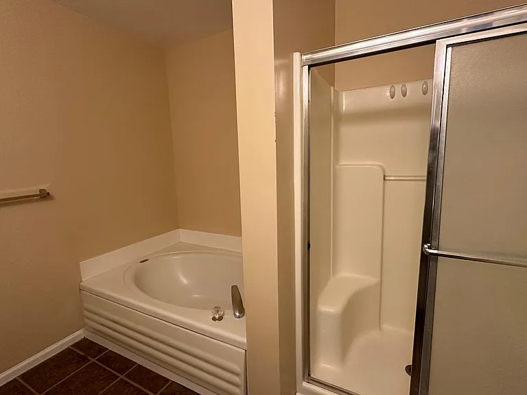 Master Bedroom - Attached full bath with two washbasin, Jacuzzi Tub and standing shower
