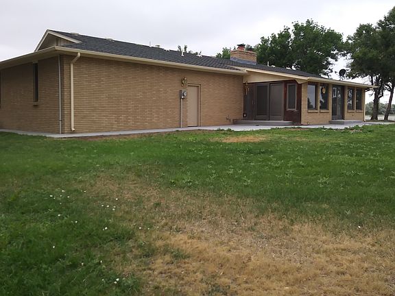 backyard w/ view of sunroom