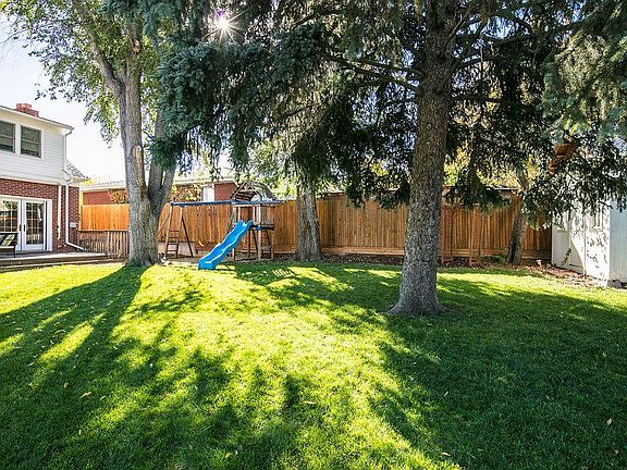Large park-like backyard walking distance to Eisenhower park and rec center (with pool and tennis courts). Featuring large deck, primary bedroom balcony, vegetable garden, storage shed and heated ADU.