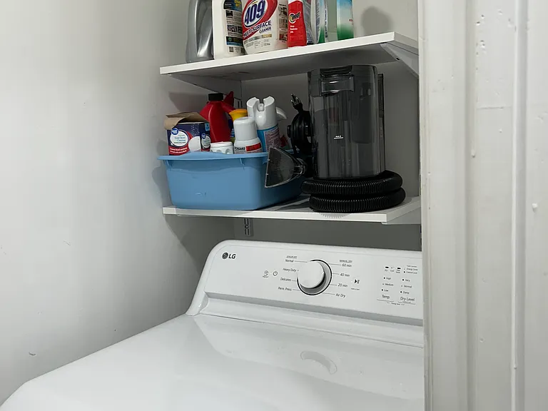 in unit laundry room with washer and dryer