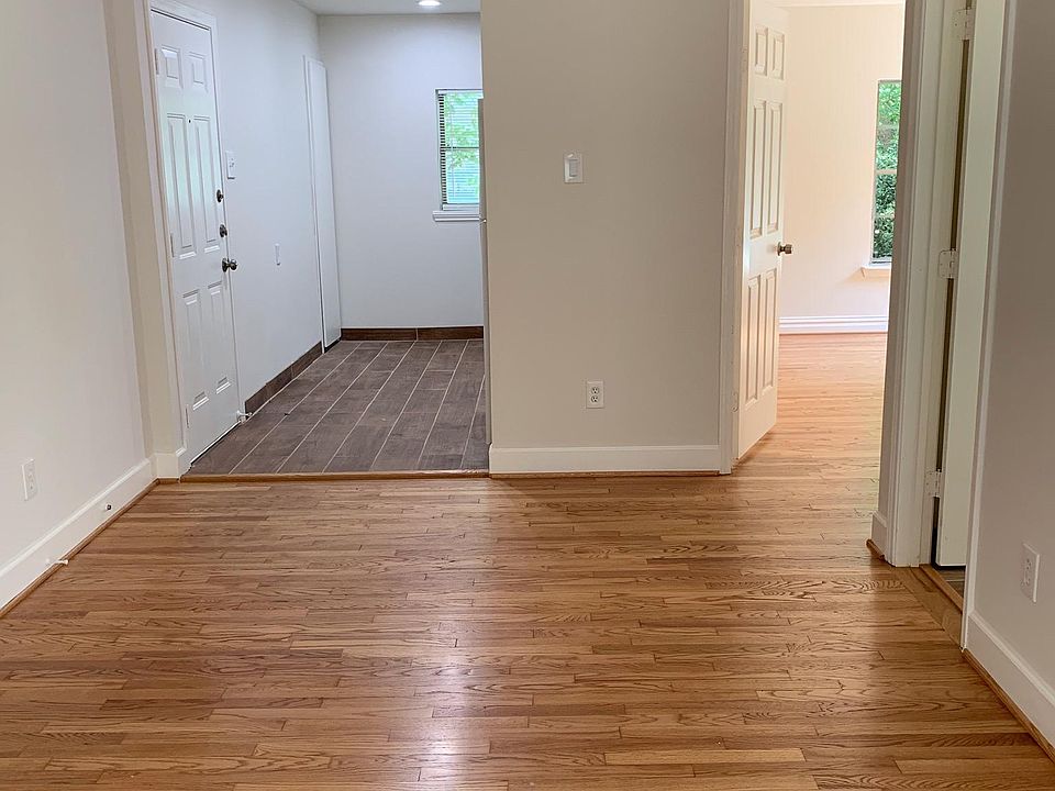View of kitchen and bedroom from living room, also back door entrance in the kitchen.