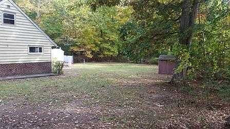 side yard leading to rear patio