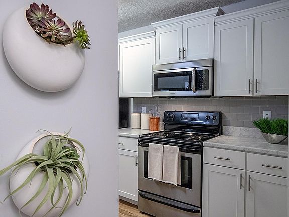 Our newly renovated kitchens feature new appliances, white cabinetry and gorgeous marble-like countertops.