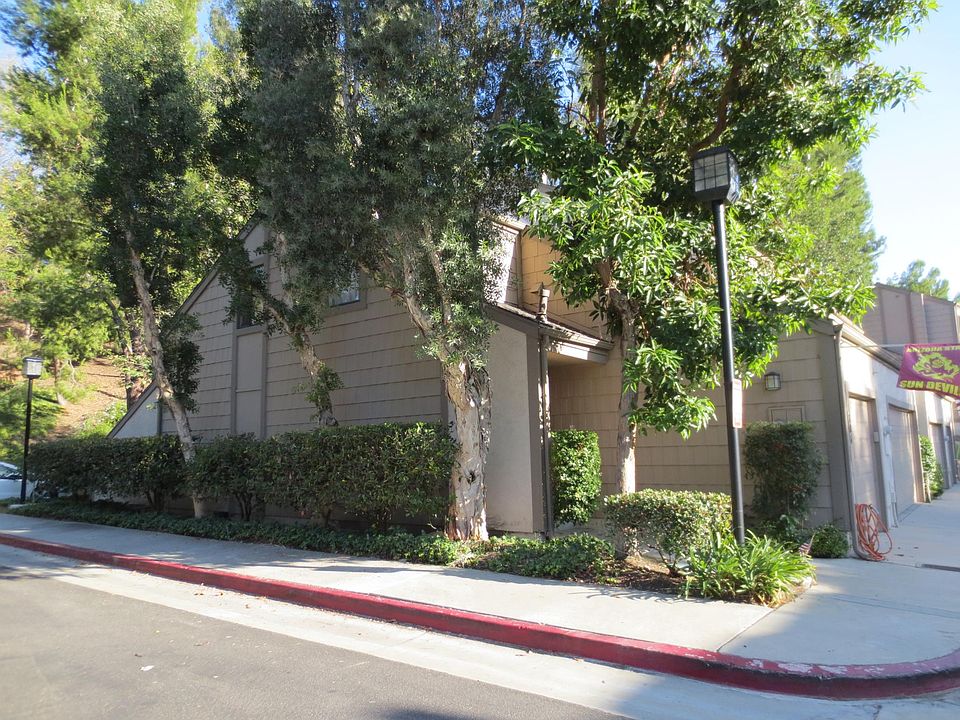 Quiet end-unit with mature trees.