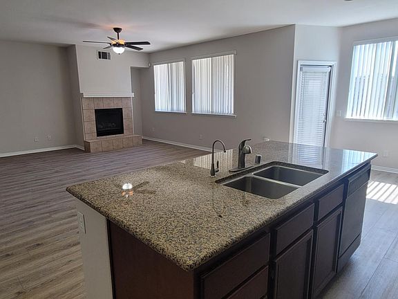 Kitchen open to Family Room with Fire Place and Main Floor Bedroom