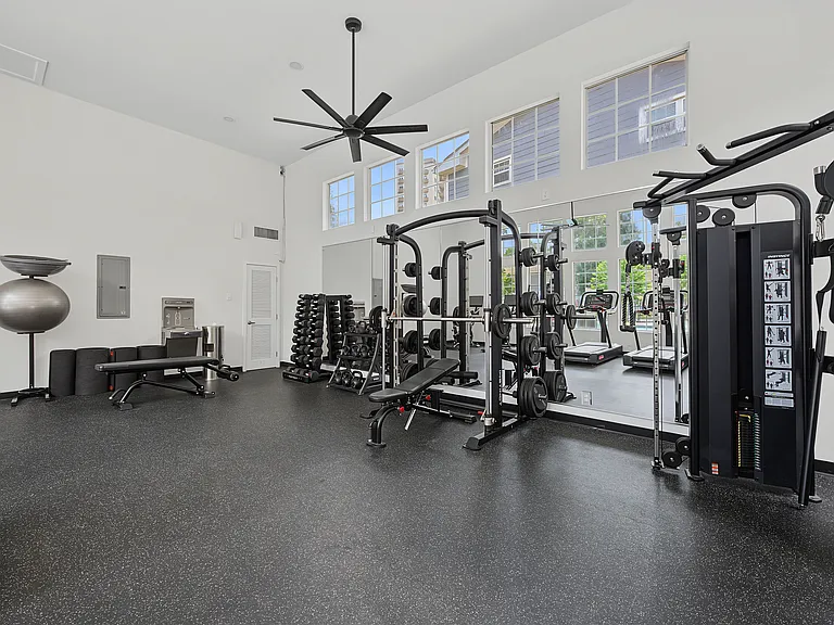 Fitness center is fully equipped with machines and free weights