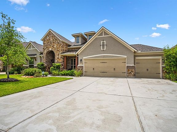 Gorgeous stacked stone/stucco elevation. 1 story home w/ 3-car garage & triple wide driveway.