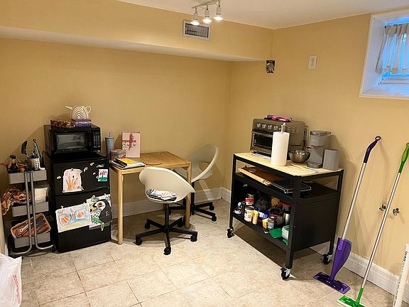Kitchen area, we will be adding a sink. Mini fridge and microwave are included.