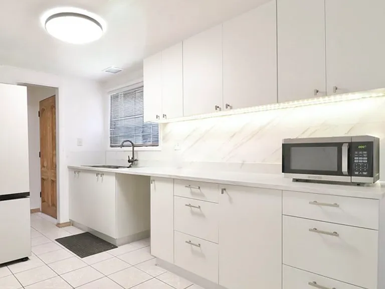 Kitchen include refrigerator with oven and stove