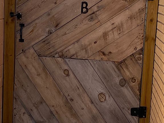 B unit Gate, left of the garage to entrance to B Unit.