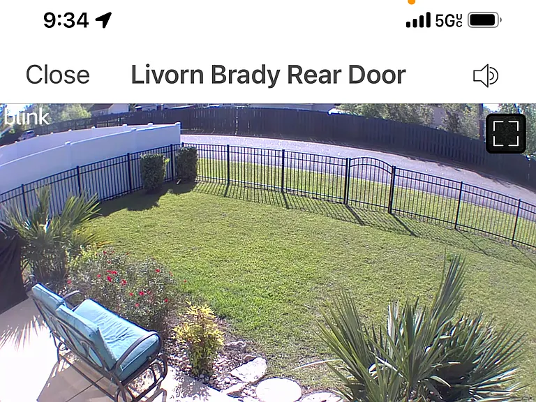 Security camera view of backyard-grill is covered to far left side