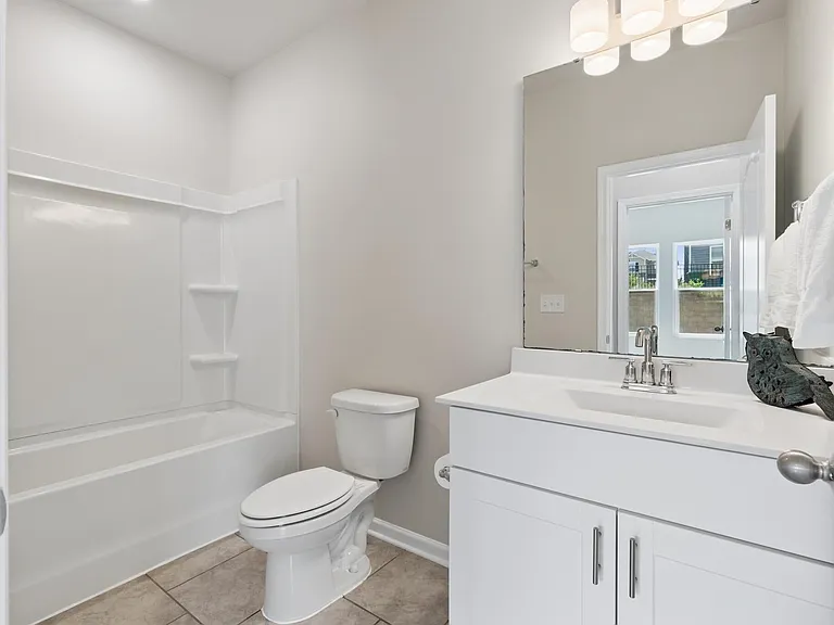Modern bath with upgraded fixtures and lighting
