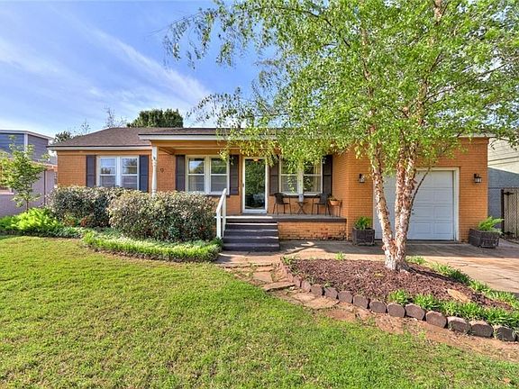 Landscaping in front yard. Sunny front porch.