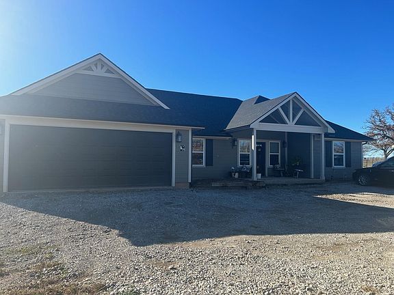 4 bed/2 bath home on over 2 acres with attached 2 car garage