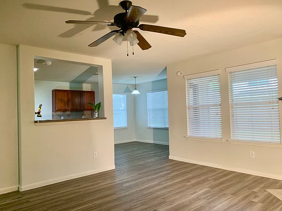 Living Room with breakfast eating area in background.