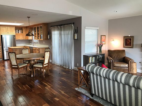 Window and slider door to side yard patio.