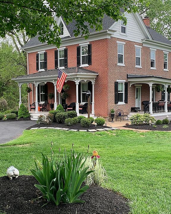 Brick, 2 covered porches 