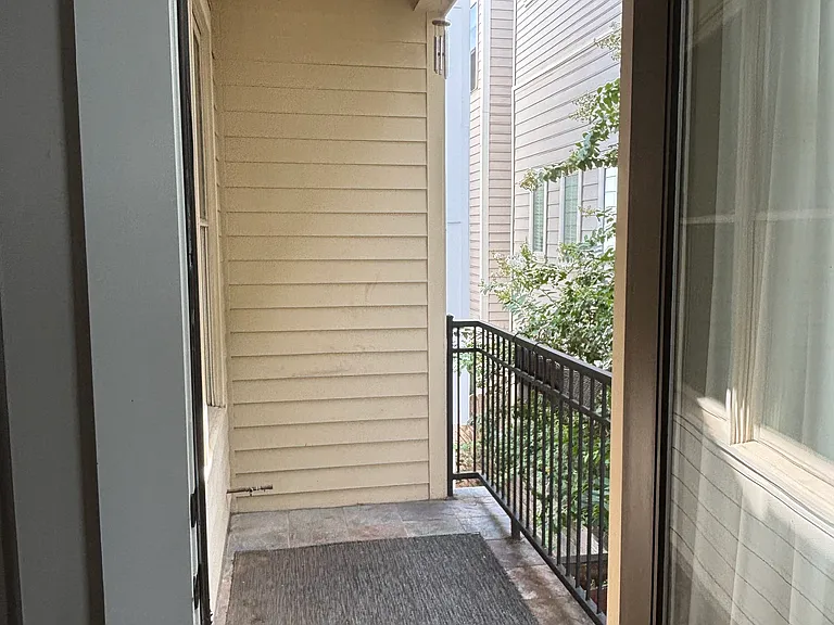 Balcony off of the kitchen area, perfect for grilling.