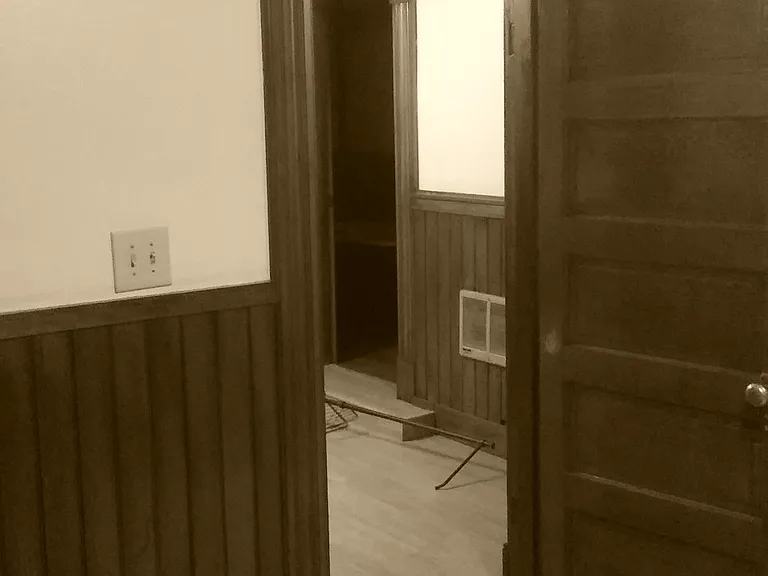 Bedroom Door Looking into the Living Room -- All Natural 100+ year-old woodwork!