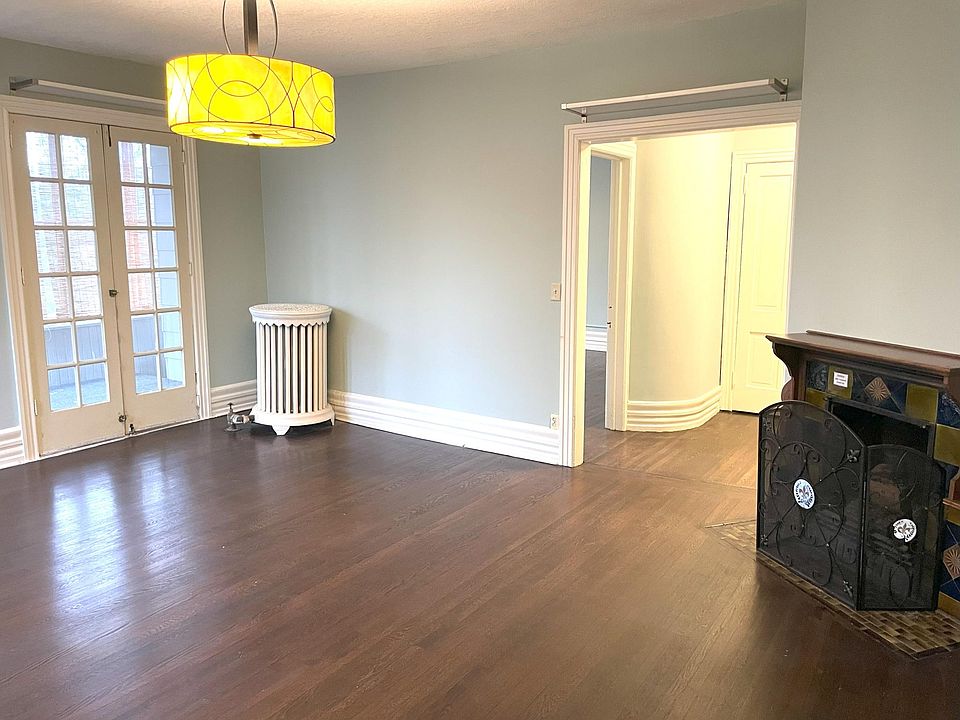 Huge living room with 3-season porch connected, south-facing