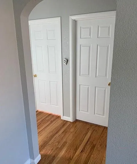 hallway with coat and storage closet