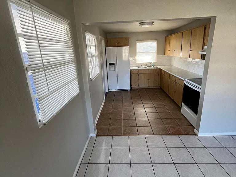 Kitchen - right off of Living Room- Electric Glass Top Stove - Fridge with Ice Maker and Water Dispenser- No garbage disposal
