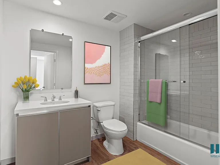 Bathroom with Shower-Bath with a Glass Door and Vanity Cabinet Storage