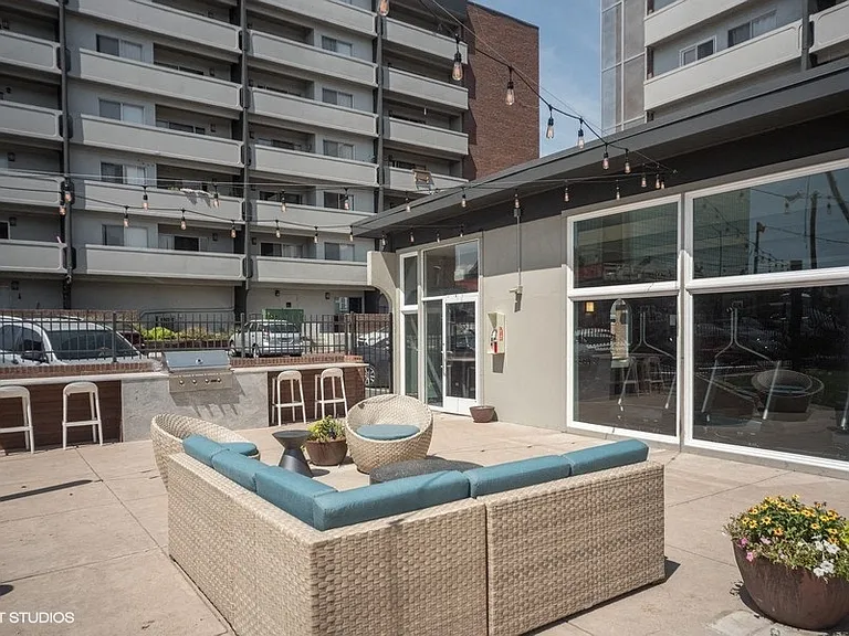 Upgraded shared patio space with grills and outdoor seating