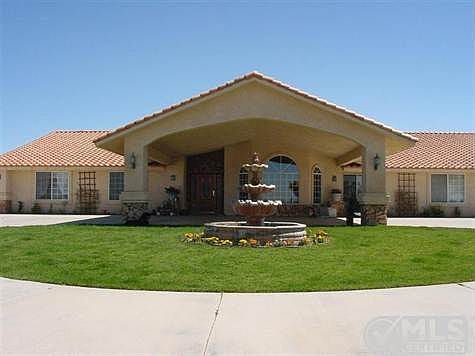 This photo was taken when the grass and garden was in.  The sellers are in the process of replanting the grass.