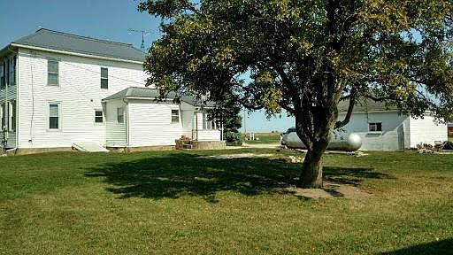 The house and garage from the back yard
