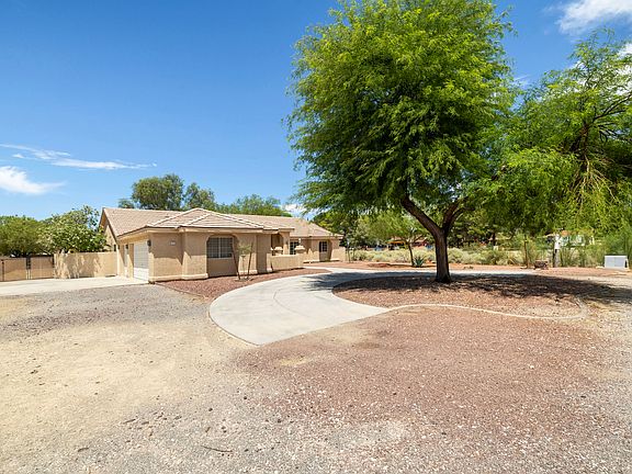 RV gate to the backyard and 3-car garage.