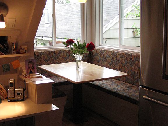 Built in kitchen table nook overlooking plum trees.

Storage built in to seating .

Small organizer nook.