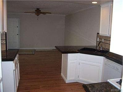 Lovely kitchen opens to family room with new wood laminate floor