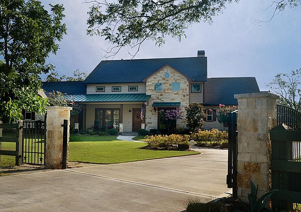 Tucked at the end of a quiet cul-de-sac behind a private gate is where you will find this remarkable