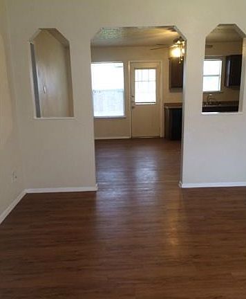 Living room looking into dining and kitchen